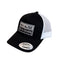Close-up of raised embroidery texture on black front panel of THIGHBRUSH trucker hat