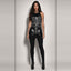 Front full-body view of dark-haired model styling black skeleton mini dress over opaque black leggings and ankle boots