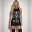 Studio shot of blonde model in fitted black skeleton mini dress with halter neck and white bone graphic print against grey
