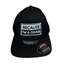 Front view of black hat with rectangular embroidered quote and Unipanel Flexfit stickers on brim