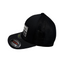 Side profile of black cap showing mesh transition and silver Flexfit size sticker on curved brim