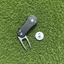 golf ball marker near the hole on putting green